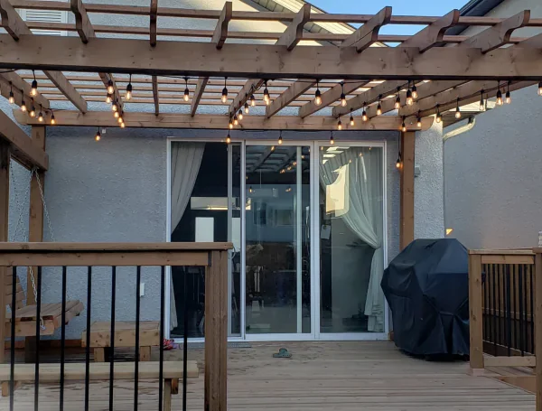 new wooden backyard deck with pergola structure