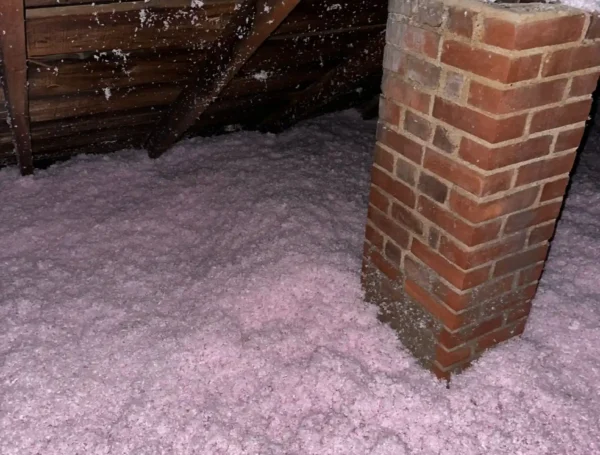 blown-in attic insulation installation in residential home