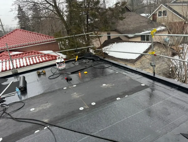 professional flat roofing installation on residential building