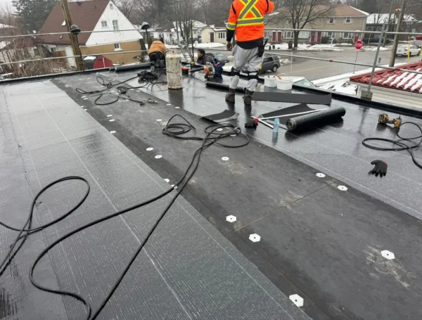 flat roof membrane installation with propane torch