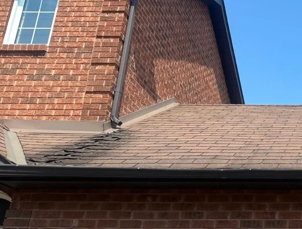 Roofing contractor inspecting and repairing roof damage