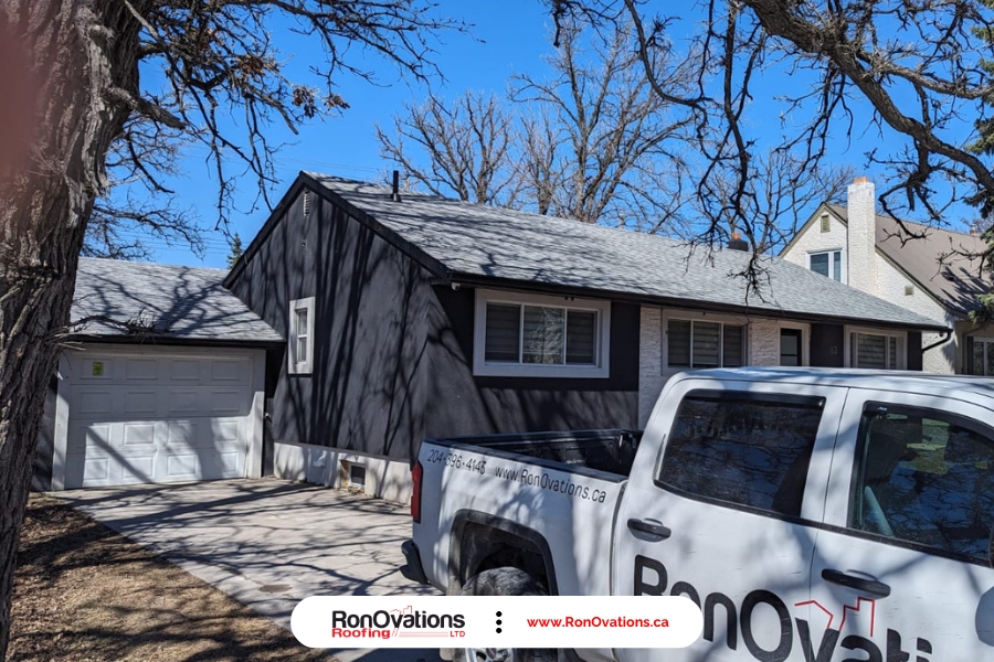 roof shingle damage caused by strong winds in Winnipeg neighborhood