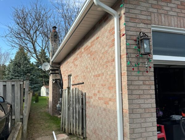 Eavestrough cleaning and repair service protecting roof drainage system