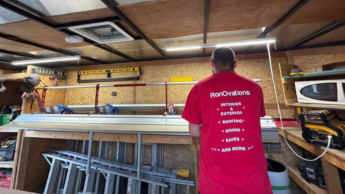 RonOvations team member in a red branded shirt at a metalworking station
